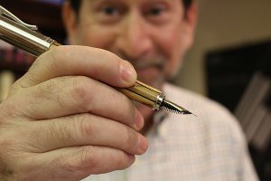 Brian Baker/Town Crier THE PEN IS MIGHTIER: Peter Laywine, owner of Laywine’s Pens and Organizers in Yorkville, says pens are always a great stocking stuffer and never go out of style, especially in a digital world.