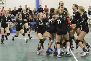 PHOTO COURTESY TOM EISENHAUER LIGHTNING STRIKES: Members of Leaside Lightning Red 18U celebrate their gold medal win, 2-0 (25-15, 25-22) over Scarborough Eclipse, at the Ontario Volleyball Association’s championship final.
