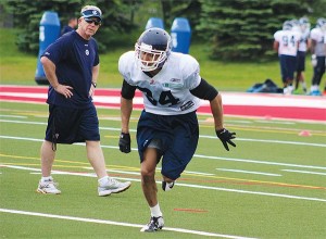 BRIAN BAKER/TOWN CRIER UNDER THE GUN: Toronto Argonauts hopeful Eric Black practises under the watchful eye of defensive coordinator Tim Burke at rookie camp on May 28. The Northern SS alum was drafted in the 5th round (38th overall).