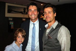 THE BOYS ARE BACK IN TOWN: Eric Hoskins, flanked by his son Rhys, left, and Our Lady Peace frontman Raine Maida, are all smiles after Hoskins was re-elected to his St. Paul’s seat, June 12.
