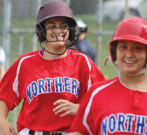 BRIAN BAKER/TOWN CRIER HOMERUN QUEEN: Northern Red Knights captain Victoria Saunders heads to the dugout after slamming the ball over the heads of Riverdale Raiders’ outfielders during a May 20 regular season tilt at Wanless Park.