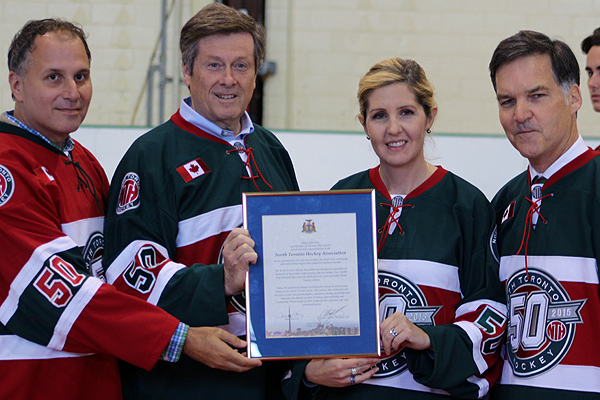 BRIAN BAKER/TOWN CRIER  CITY HALL NOD: Councillor Josh Colle, Mayor John Tory, councillor Christin Carmichael-Greb and NTHA board president Ben Hawkins, pose with a commemorative plaque from the mayor's office for the league's service to the community. 